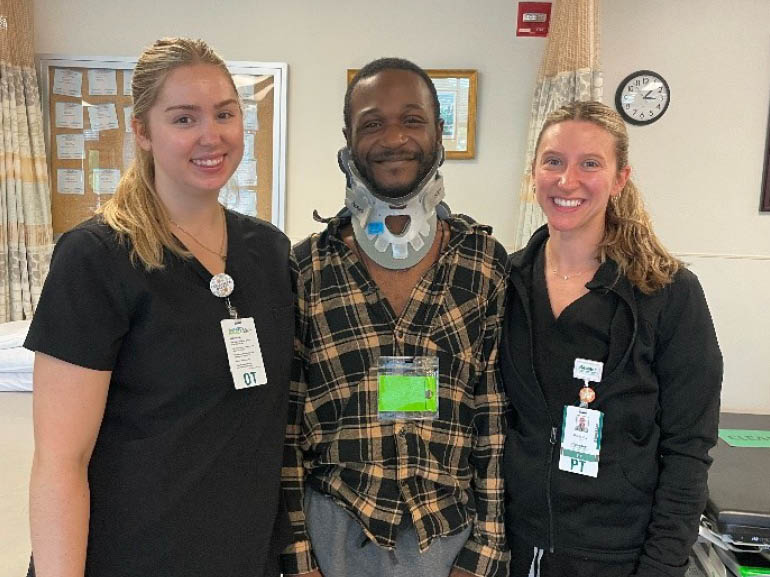 Tavion Williams and his therapists at Kessler Institute for Rehabilitation.