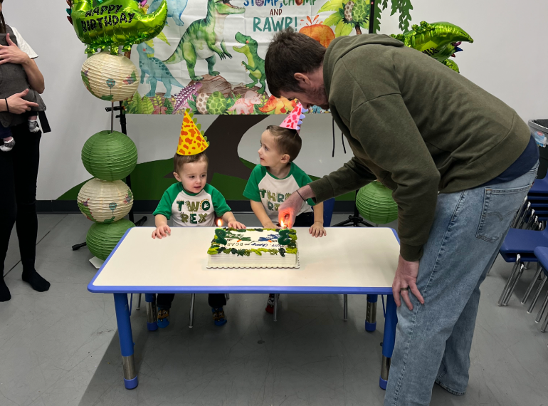 Brian and his sons at a birthday party.