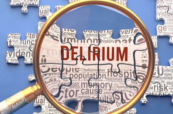 A magnifying glass focuses in on the word delirium on puzzle pieces.